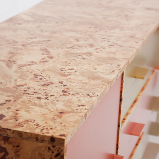 Modern sideboard with brushed copper and brass drawers on black steel base