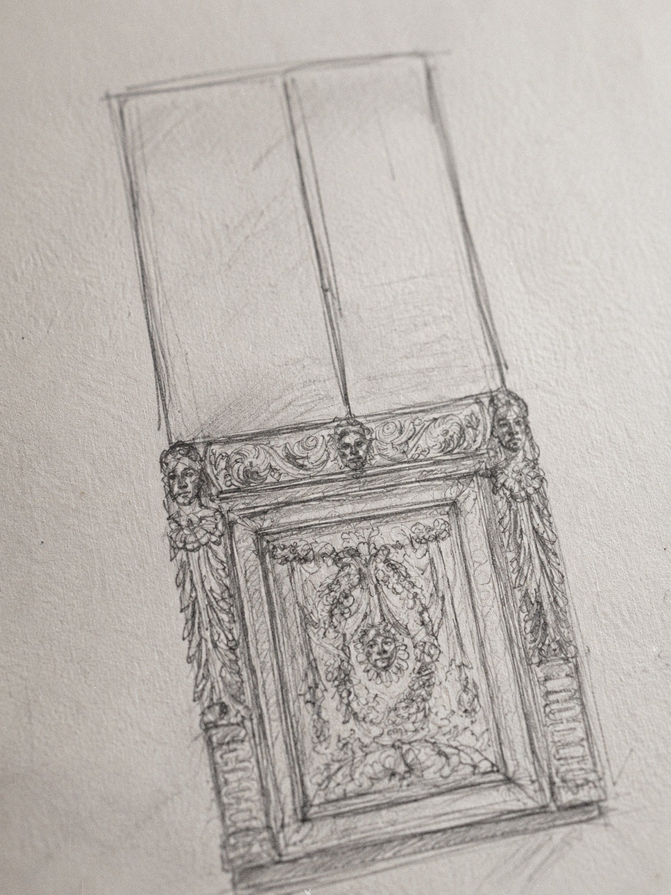 A pencil sketch of an ornate classical wall panel or decorative molding, drawn on textured off-white paper.