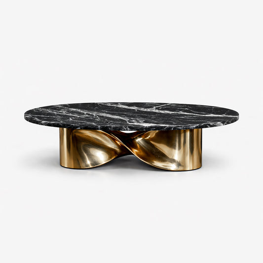 Radiance dining table with black marble oval top and sculptural polished gold stainless steel base in luxury interior.