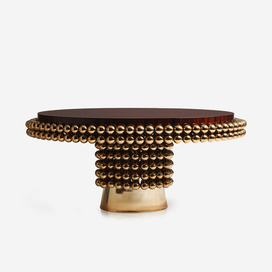 Luxury round dining table with polished gold sphere base and wood veneer top