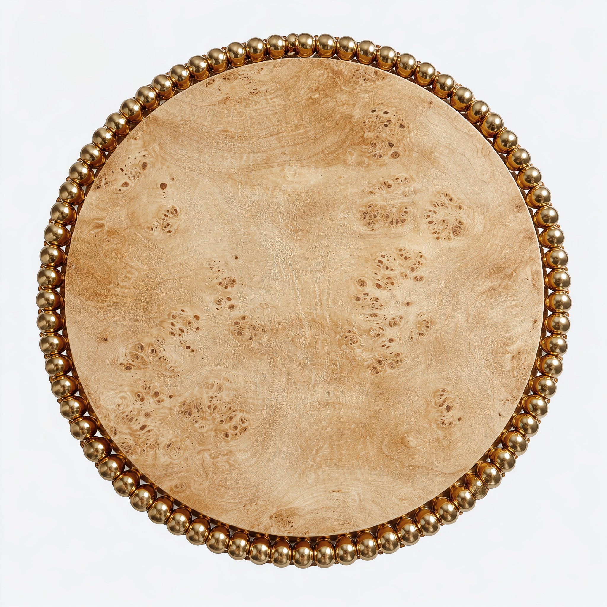 Sculptural dining table featuring swirling poplar burl top and gold sphere pedestal.