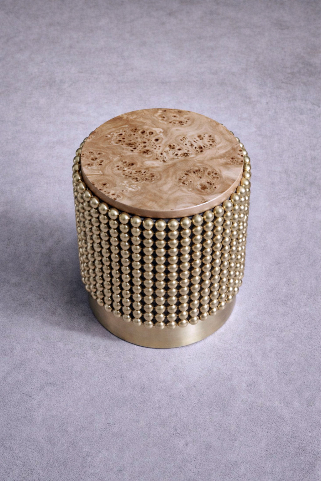 Luxury side table with gold-plated spheres and figured poplar burl wood surface, designed by Railis Kotlevs