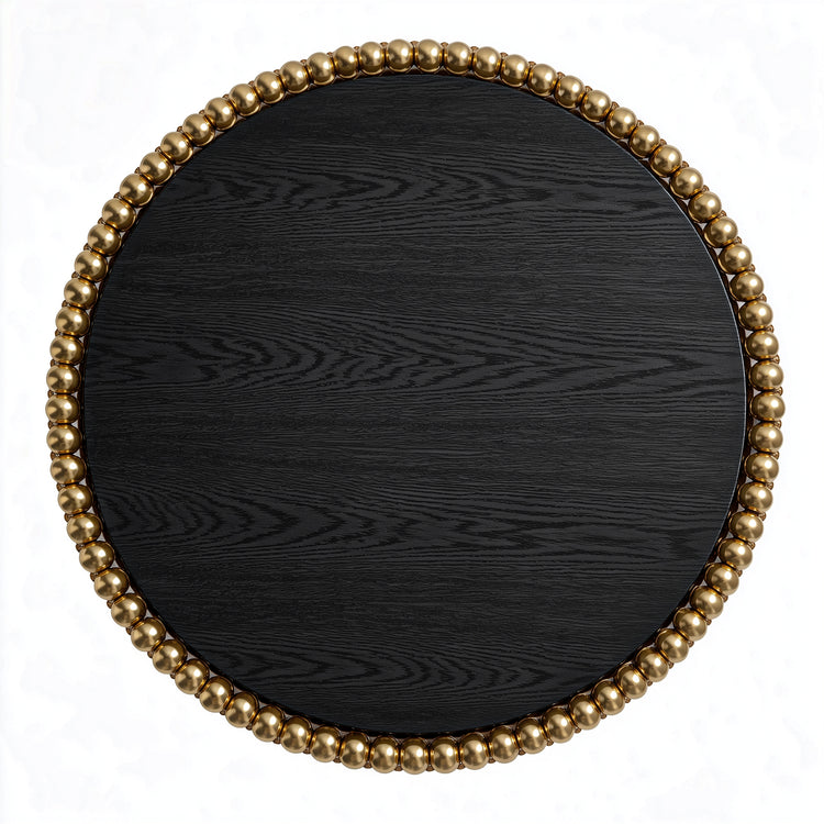 Round dining table in black ash veneer with clustered gold-plated stainless steel spheres