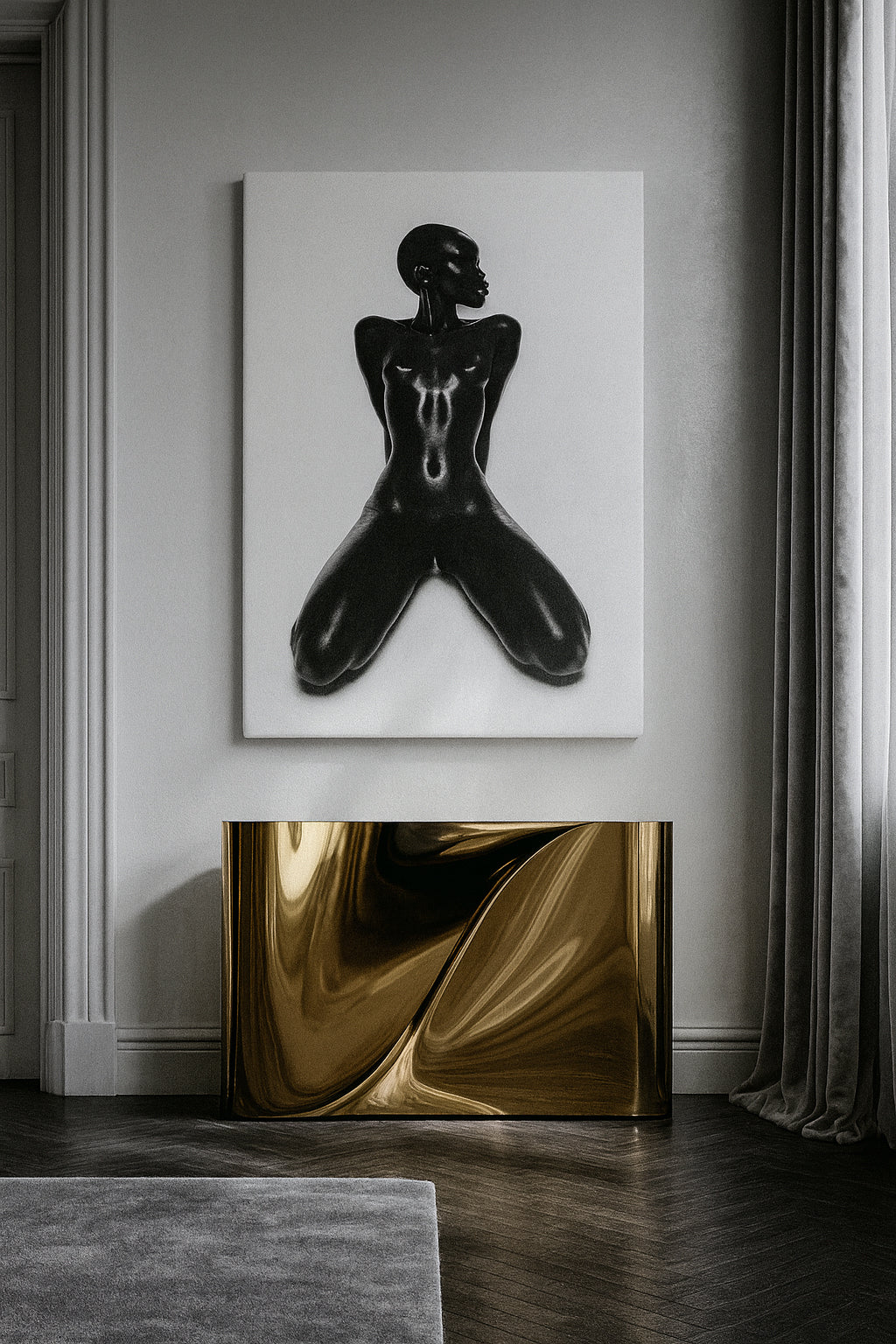 Abstract black and white painting on a gray wall with a gold console table below.