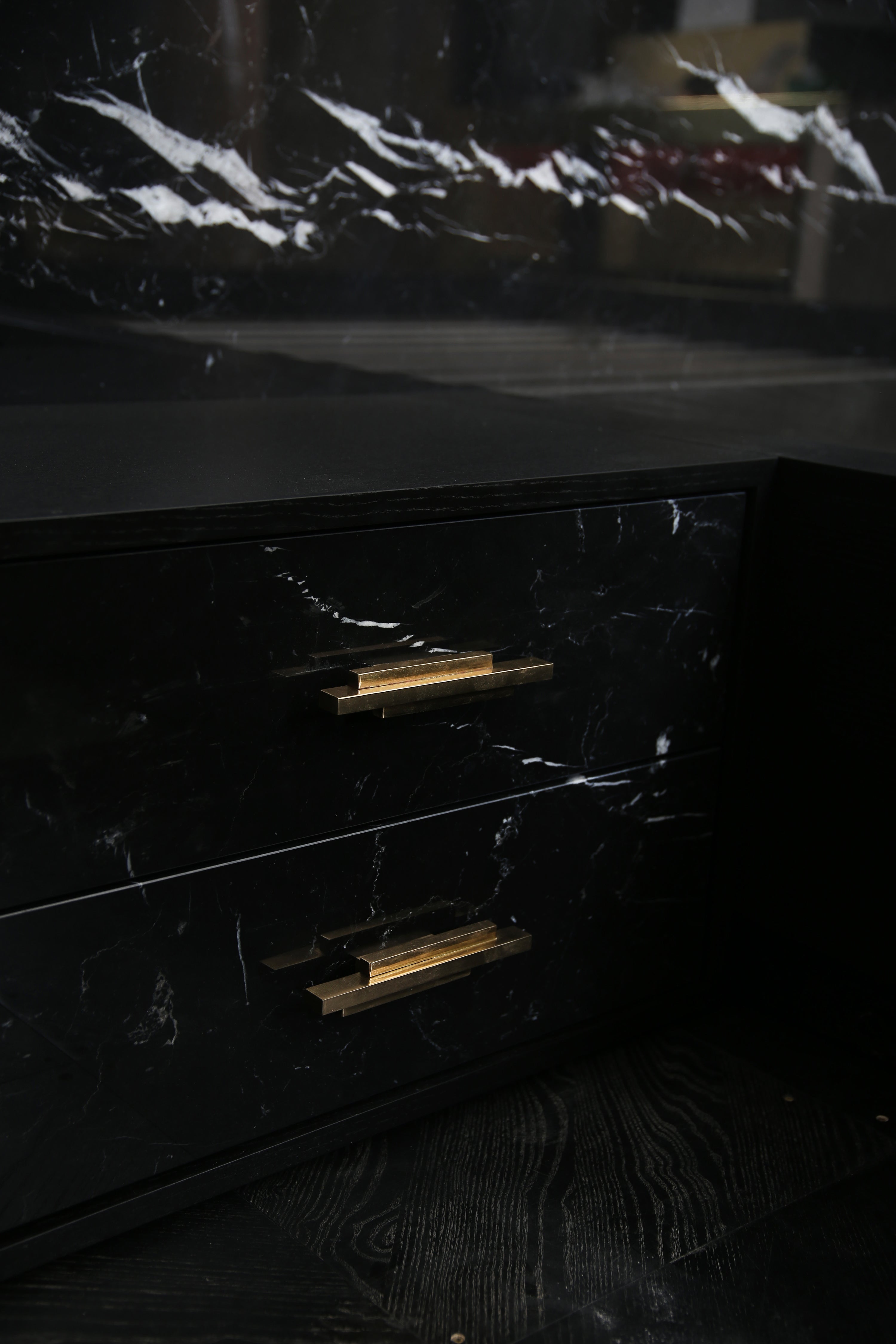 Detail view of brass hardware and marble veining on Dettifoss Bed.