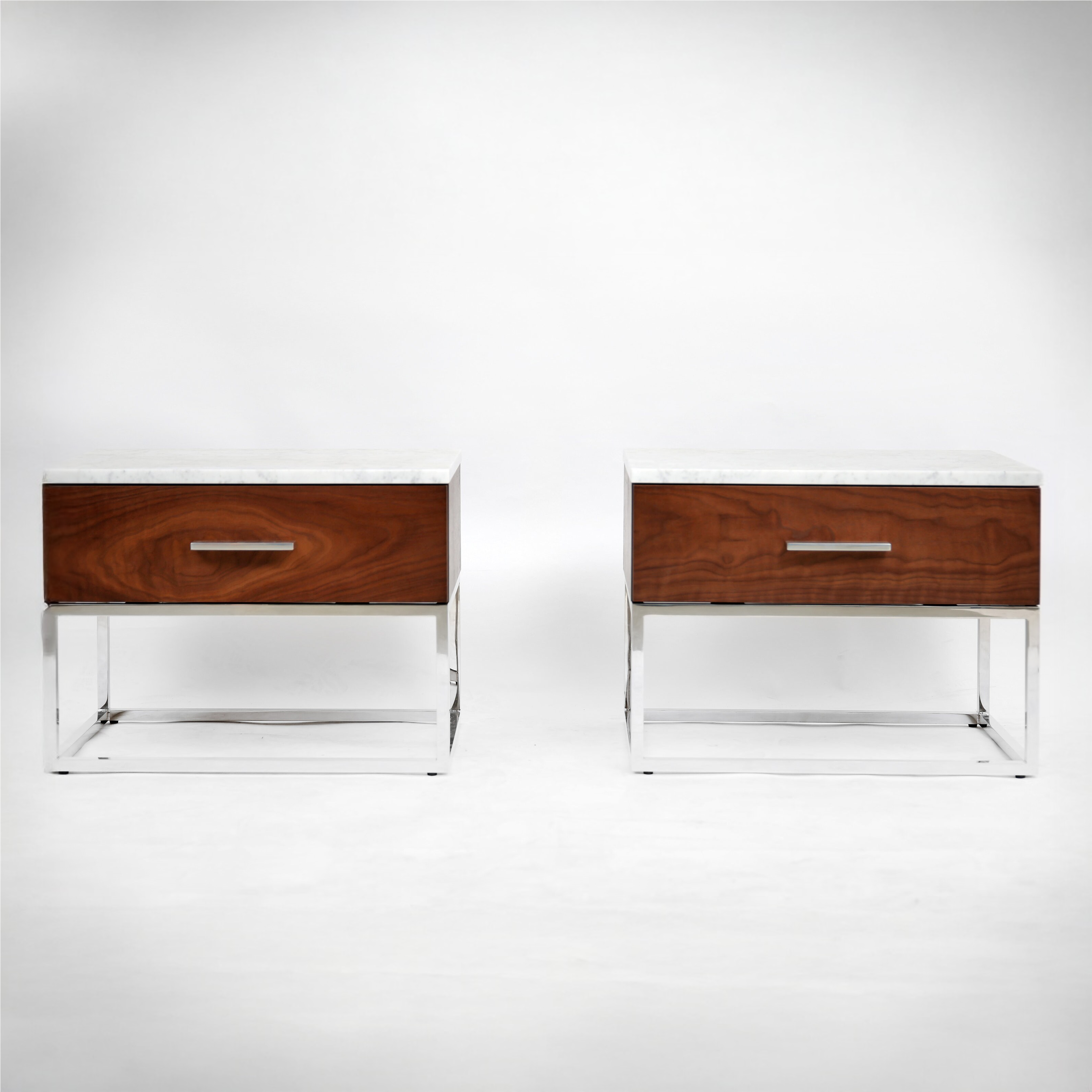 Minimalist bedside table with marble top and geometric stainless steel base