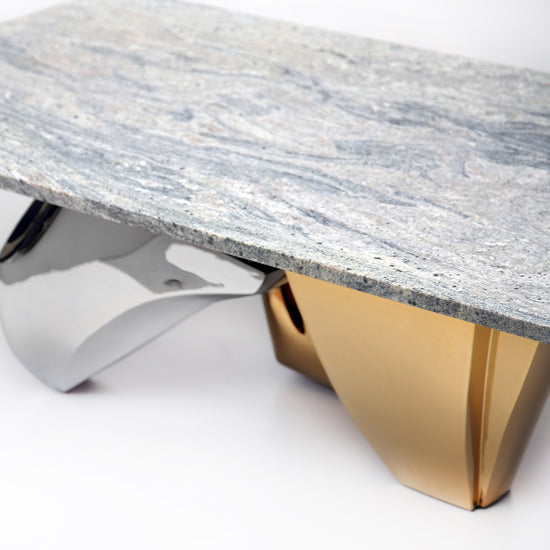 Contemporary designer table with Kinawa granite top and metal base.