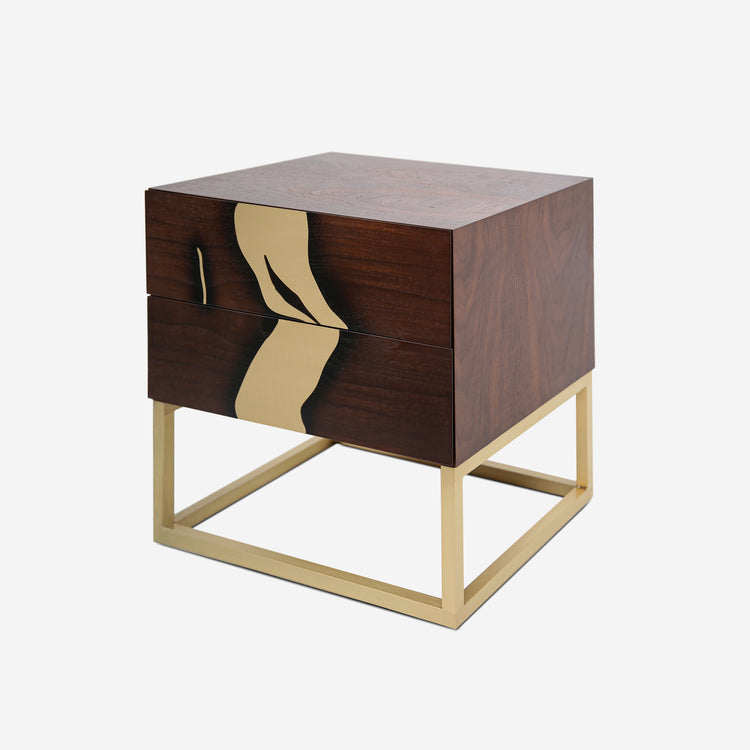 Close-up of brushed brass inlay on walnut nightstand drawer front