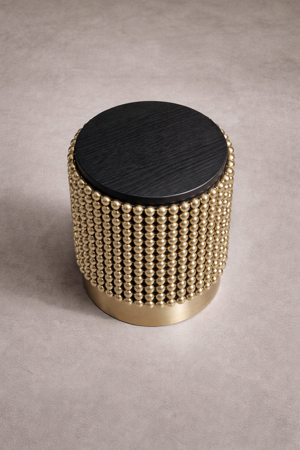 Contemporary designer side table in black ash veneer and gold spheres, designed by Railis Kotlevs