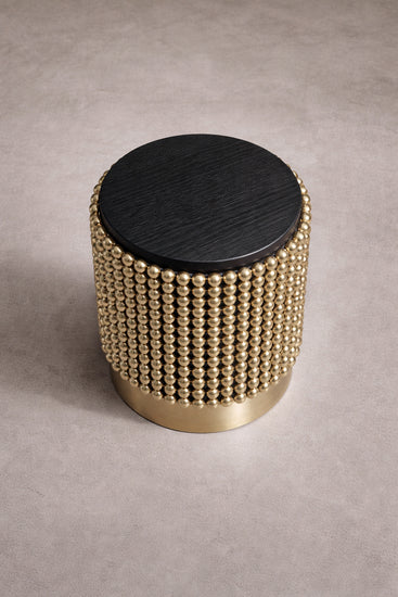 Contemporary designer side table in black ash veneer and gold spheres, designed by Railis Kotlevs