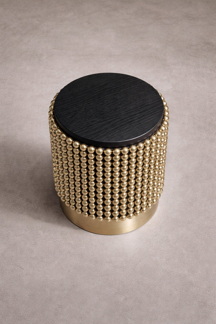 Contemporary designer side table in black ash veneer and gold spheres, designed by Railis Kotlevs