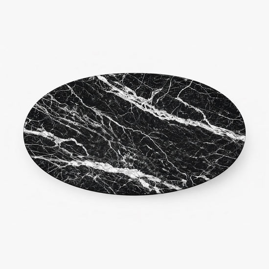 Black marble oval stone on a white background