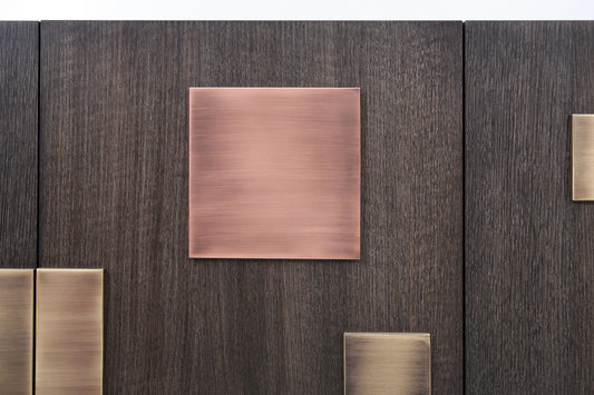 Luxury geometric sideboard handcrafted with solid copper and brass blocks on matte dark oak.