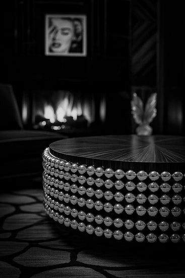 Modern sculptural coffee table on white studio background, part of Hekla Property’s Lustra Collection.