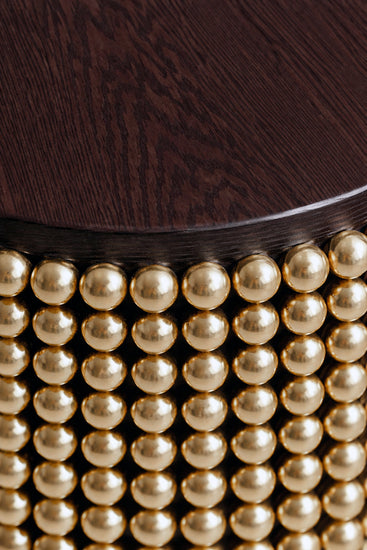 Sculptural side table featuring gold metal spheres and wenge wood tabletop
