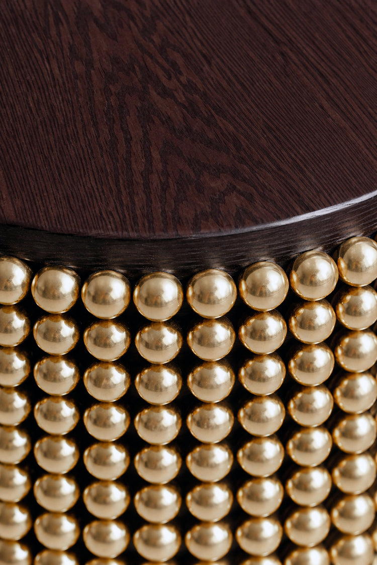 Sculptural side table featuring gold metal spheres and wenge wood tabletop