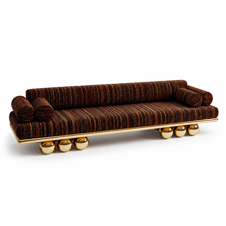Lustra Sofa by Hekla Property with dark striped woven upholstery, cylindrical cushions, polished gold rail, and sculptural gold sphere legs.