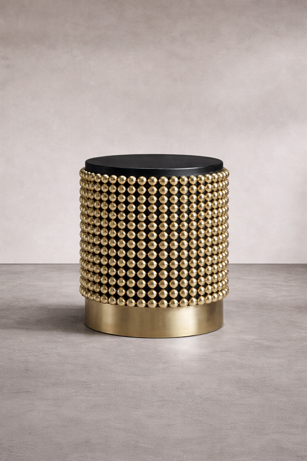 Architectural side table with gold sphere structure and matte black ash top, designed by Railis Kotlevs