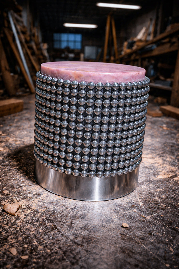 Contemporary accent table in pink onyx with mirrored chrome sphere column base
