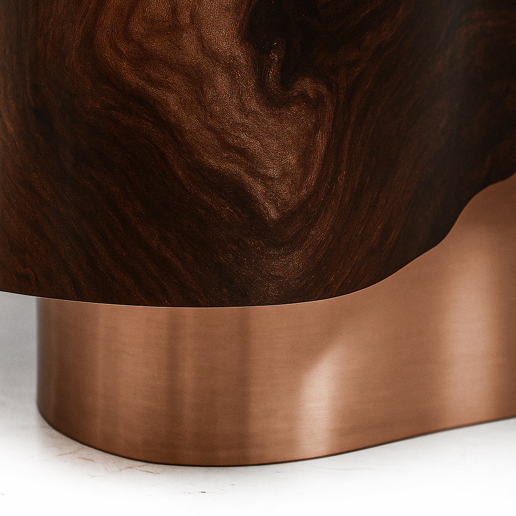 Artistic walnut burl storage cabinet with fluid contours and reflective copper detailing.