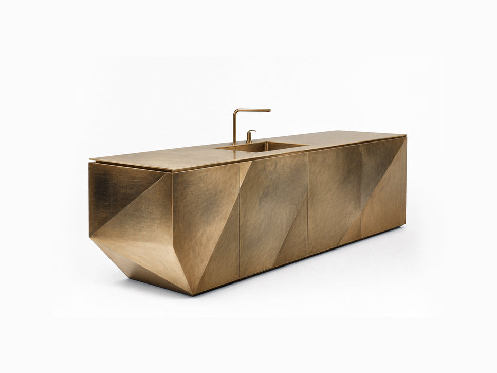 A modern rectangular kitchen island cabinet with a brushed brass or bronze metallic finish, featuring a built-in sink and a matching curved faucet, shown on a clean white background.