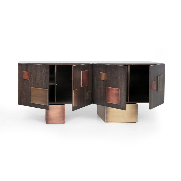 Modern designer sideboard with patinated brass and copper accents on sculptural wooden base.