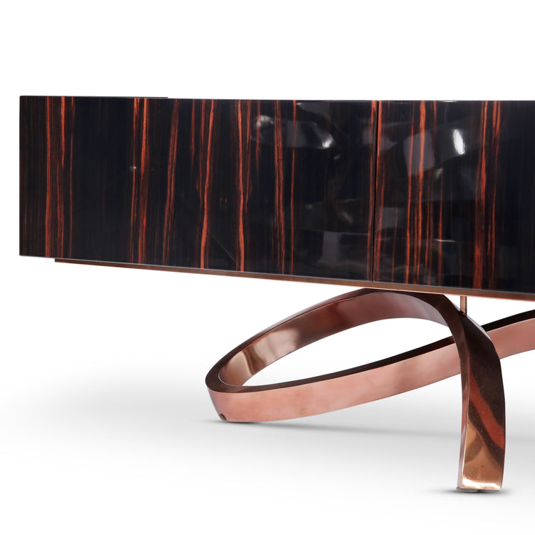Polished Macassar Ebony cabinet with sculptural brass-tone base and modern silhouette