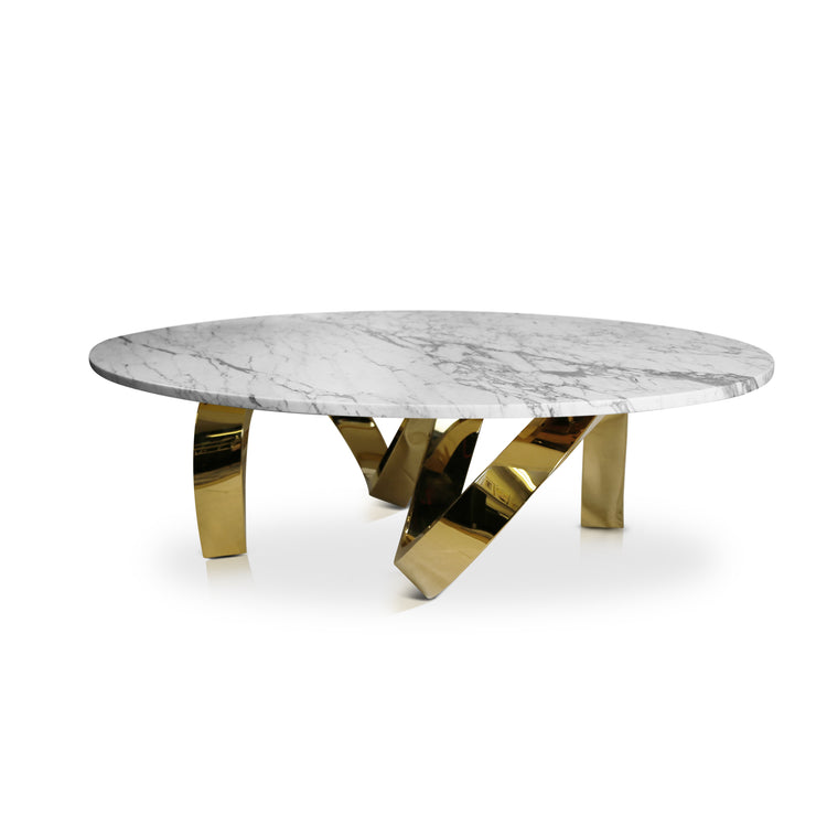 Sculptural designer coffee table – marble top and reflective gold legs.