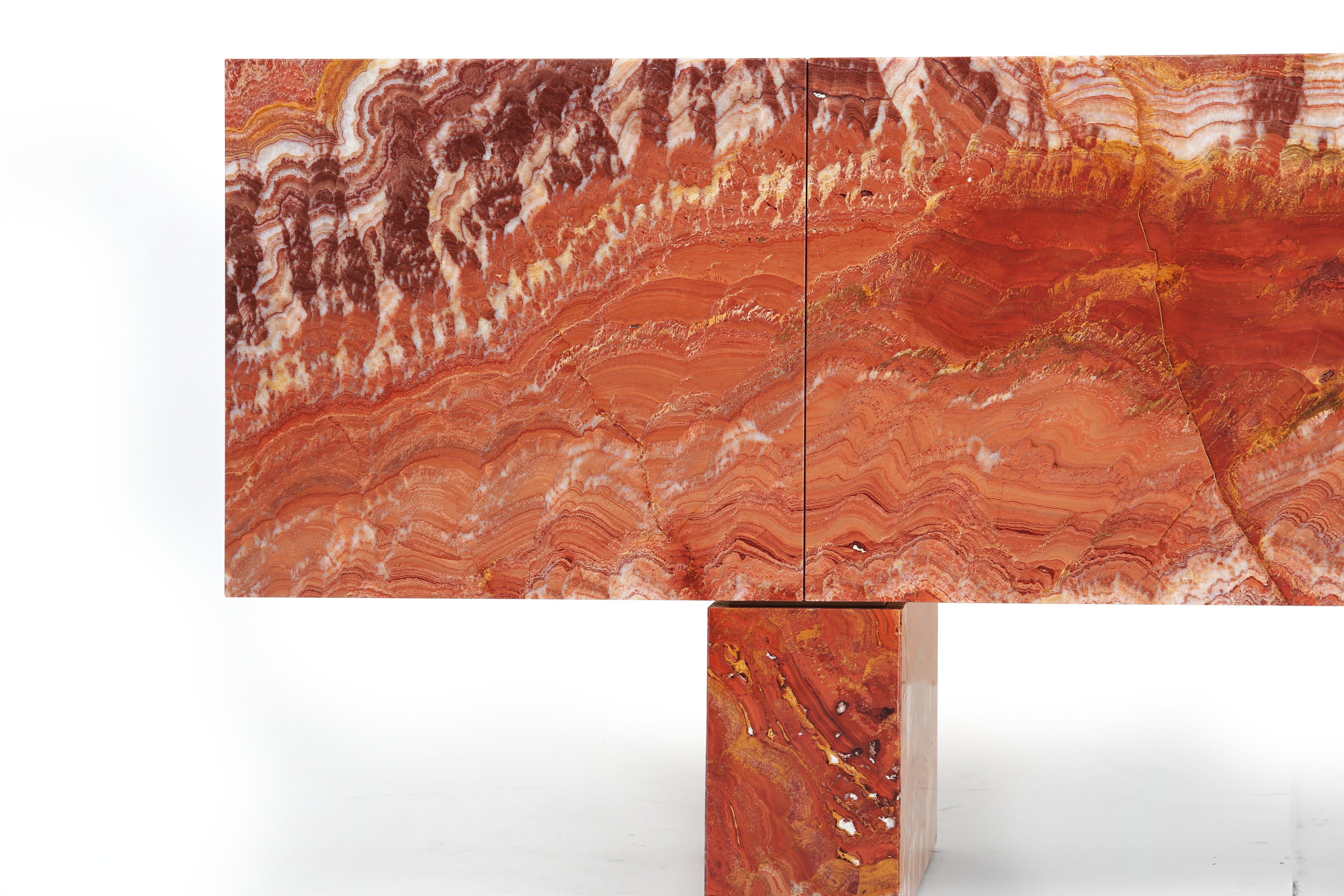 Polished red onyx luxury furniture design by Hekla Property