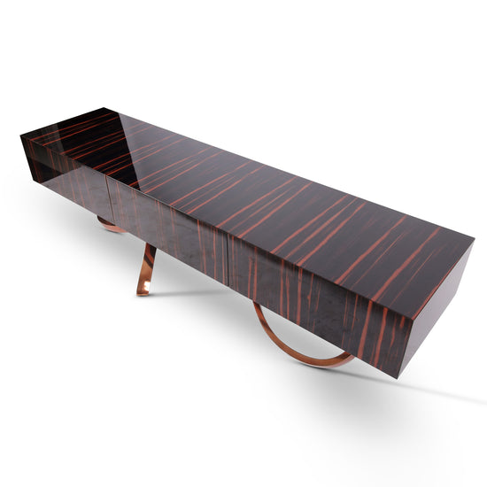 Erebus luxury sideboard combining natural ebony veneer and polished metallic base
