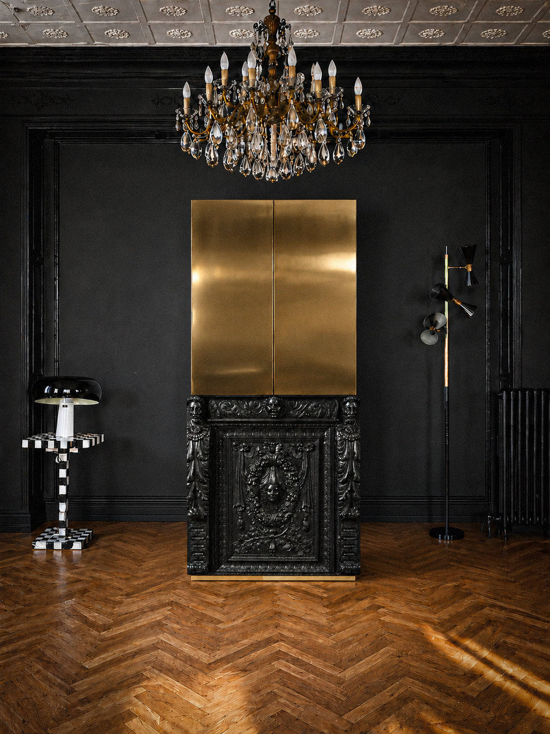 Bespoke drinks cabinet with classical carved lower section and contemporary brass upper doors.