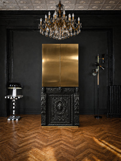 Bespoke drinks cabinet with classical carved lower section and contemporary brass upper doors.