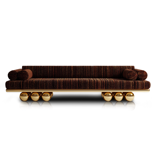 Handmade designer sofa with sculptural gold base and modern silhouette.