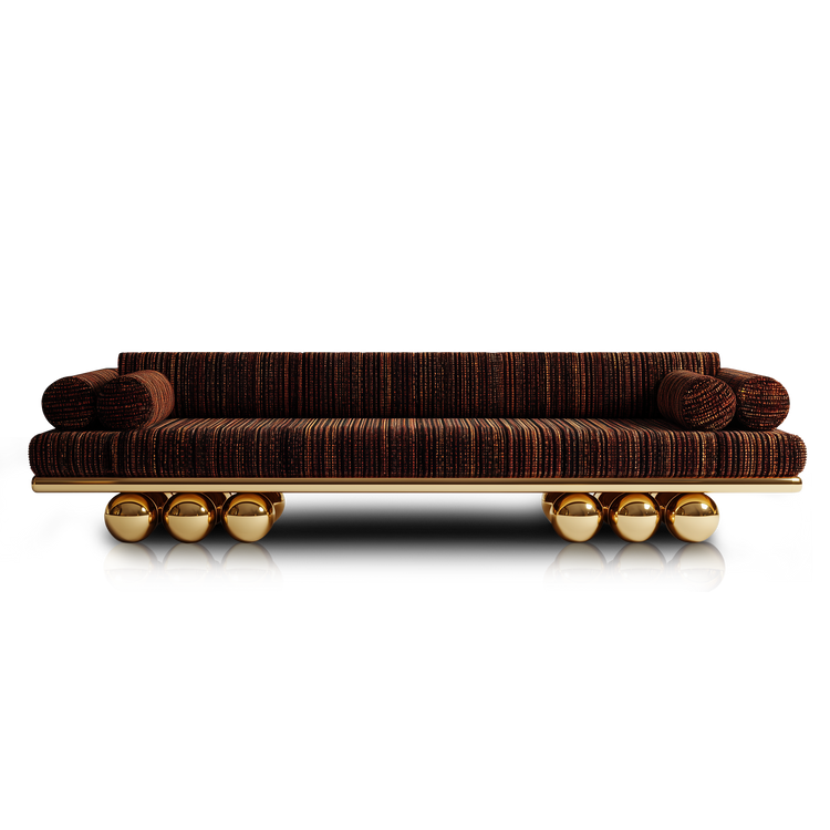 Handmade designer sofa with sculptural gold base and modern silhouette.