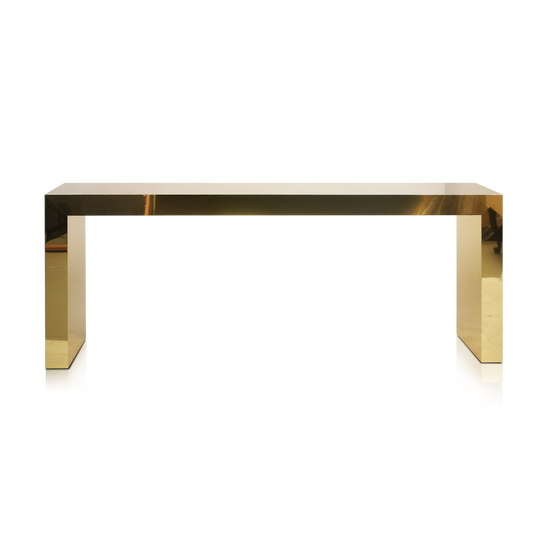 Polished brass console table with minimalist geometric design by Hekla Property.