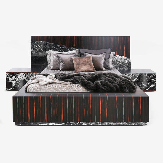 Modern bedroom set with marble-patterned headboard and footboard on a white background